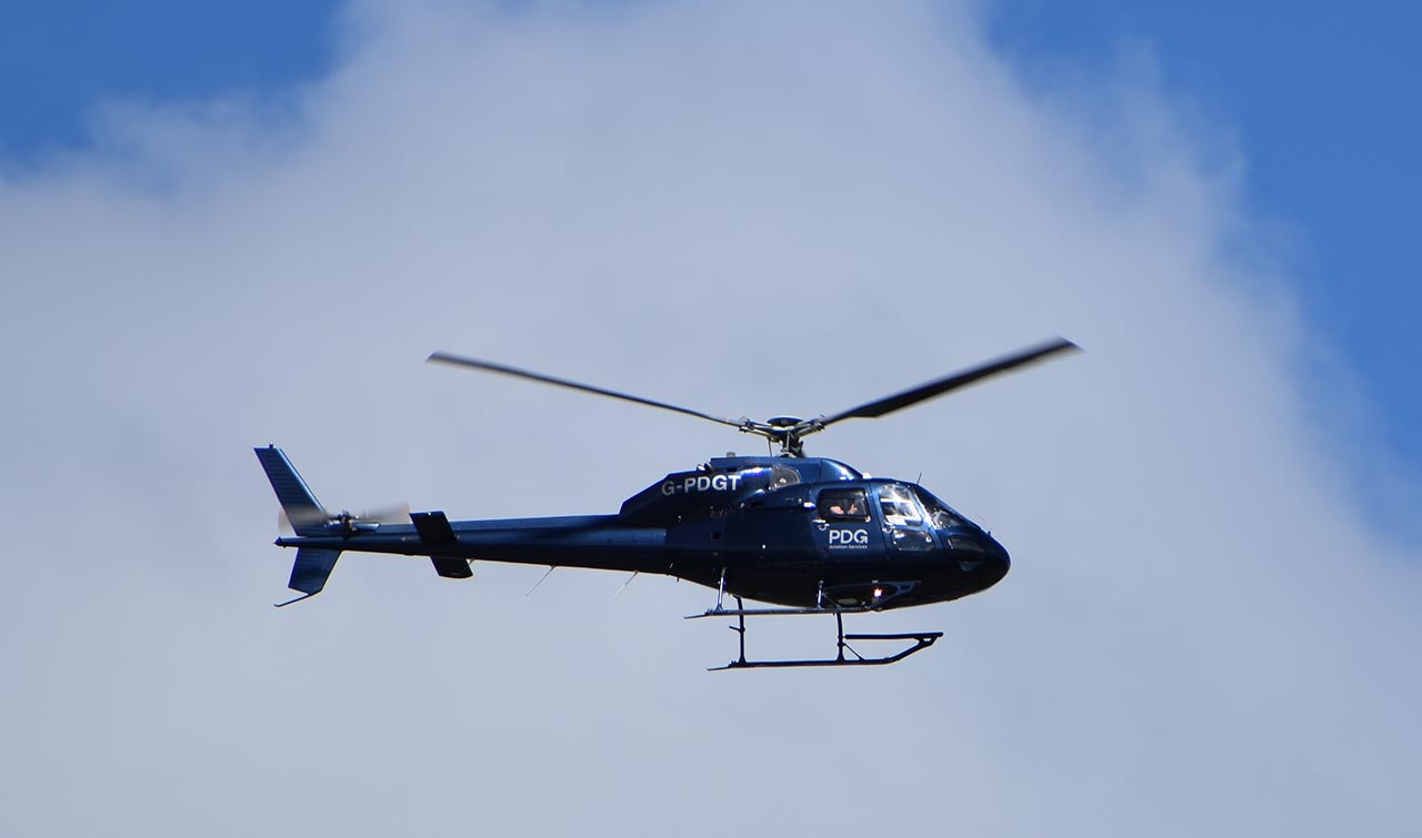 blue helicopter in the air