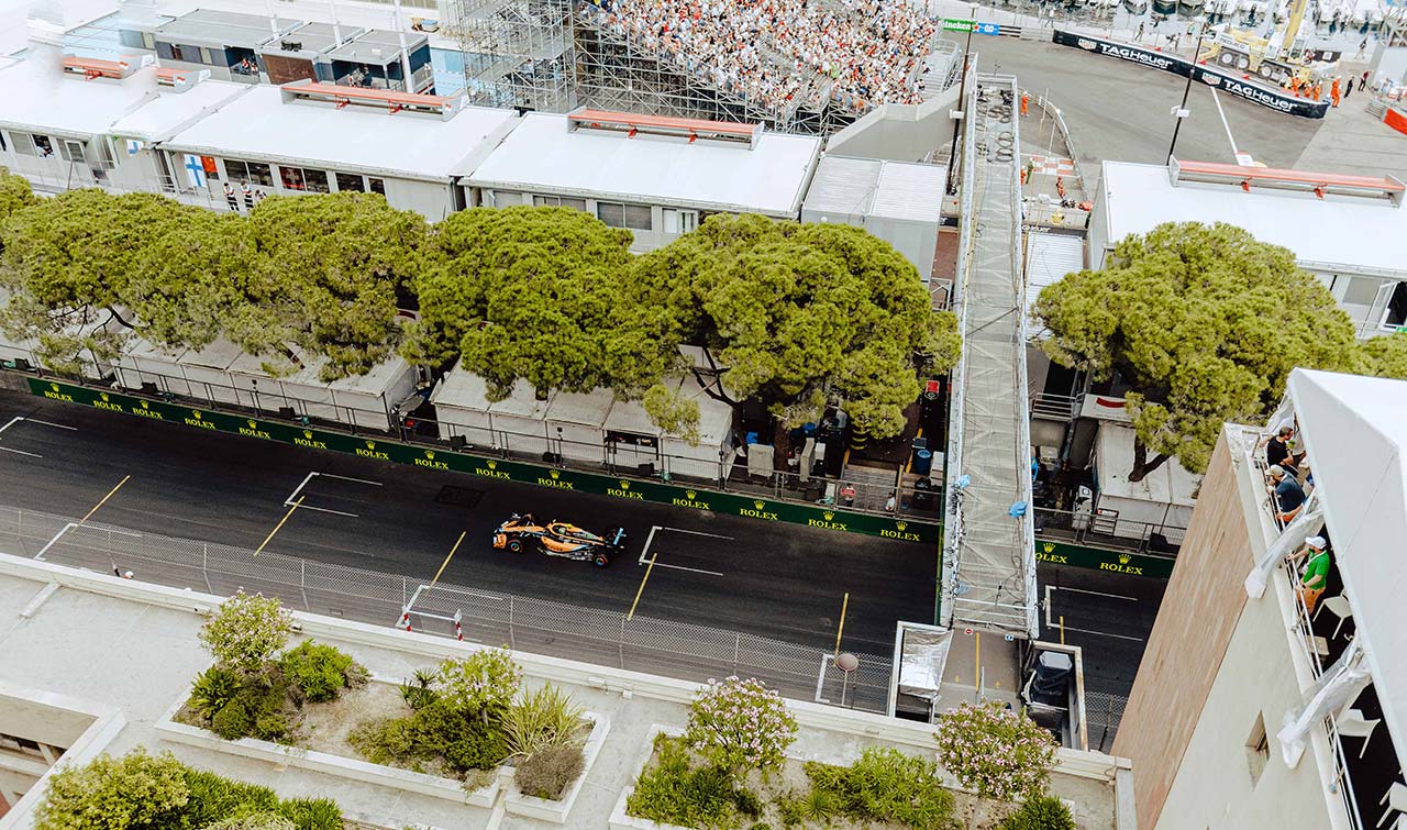 looking down from shangri la balcony on to the pitlane with a F1 car driving by