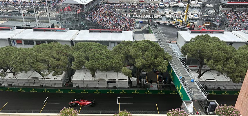 view of a ferrari f1 car racing by from the shangri la balcony