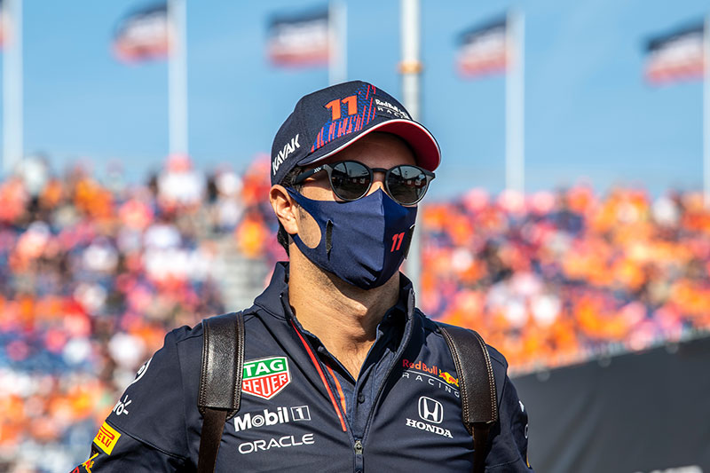 f1 driver with a facemask on