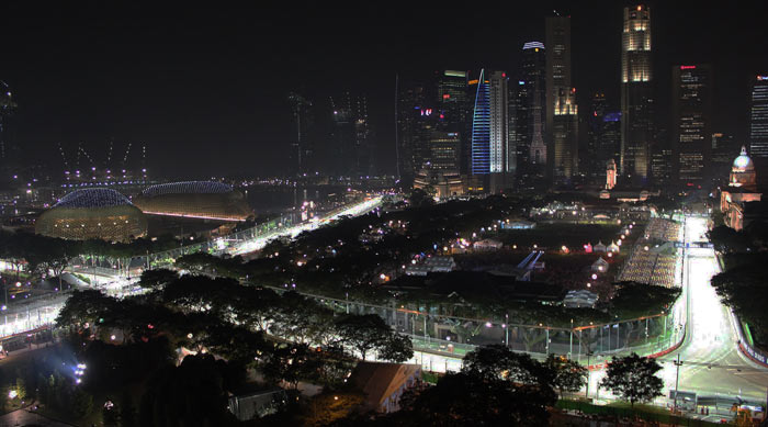 city of singapore at night with the racing track lit up