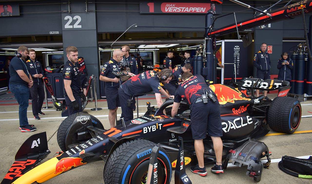 technicians working on red bull f1 car