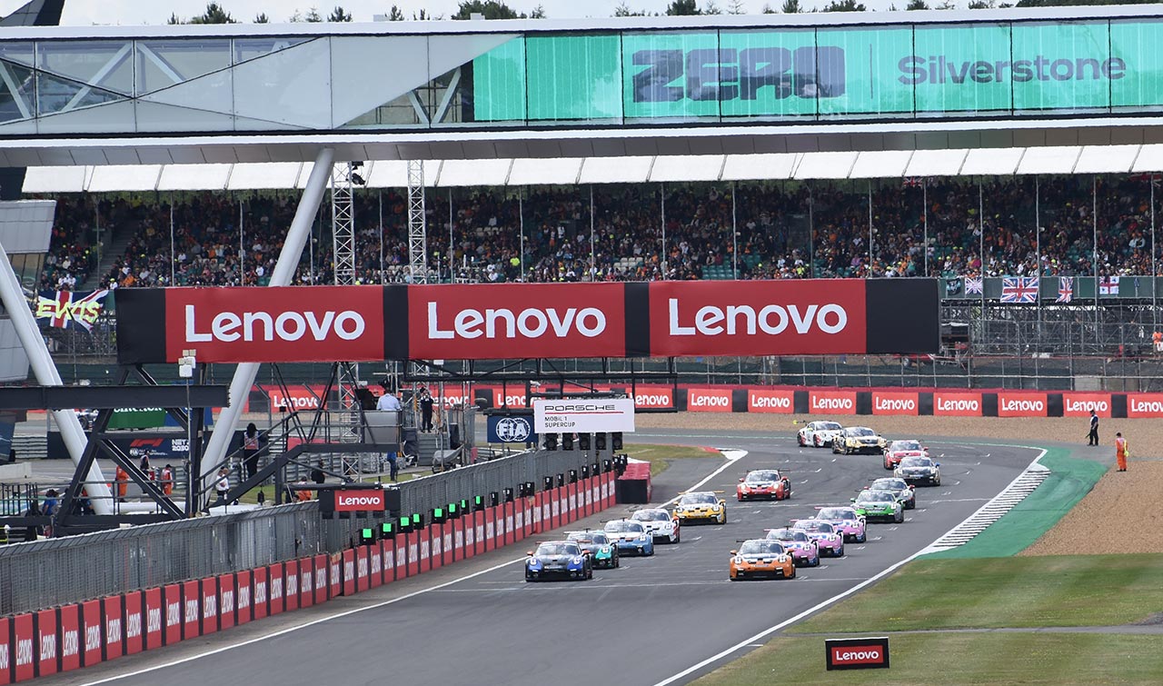 porsche cars lined up to start racing lenove signs in view
