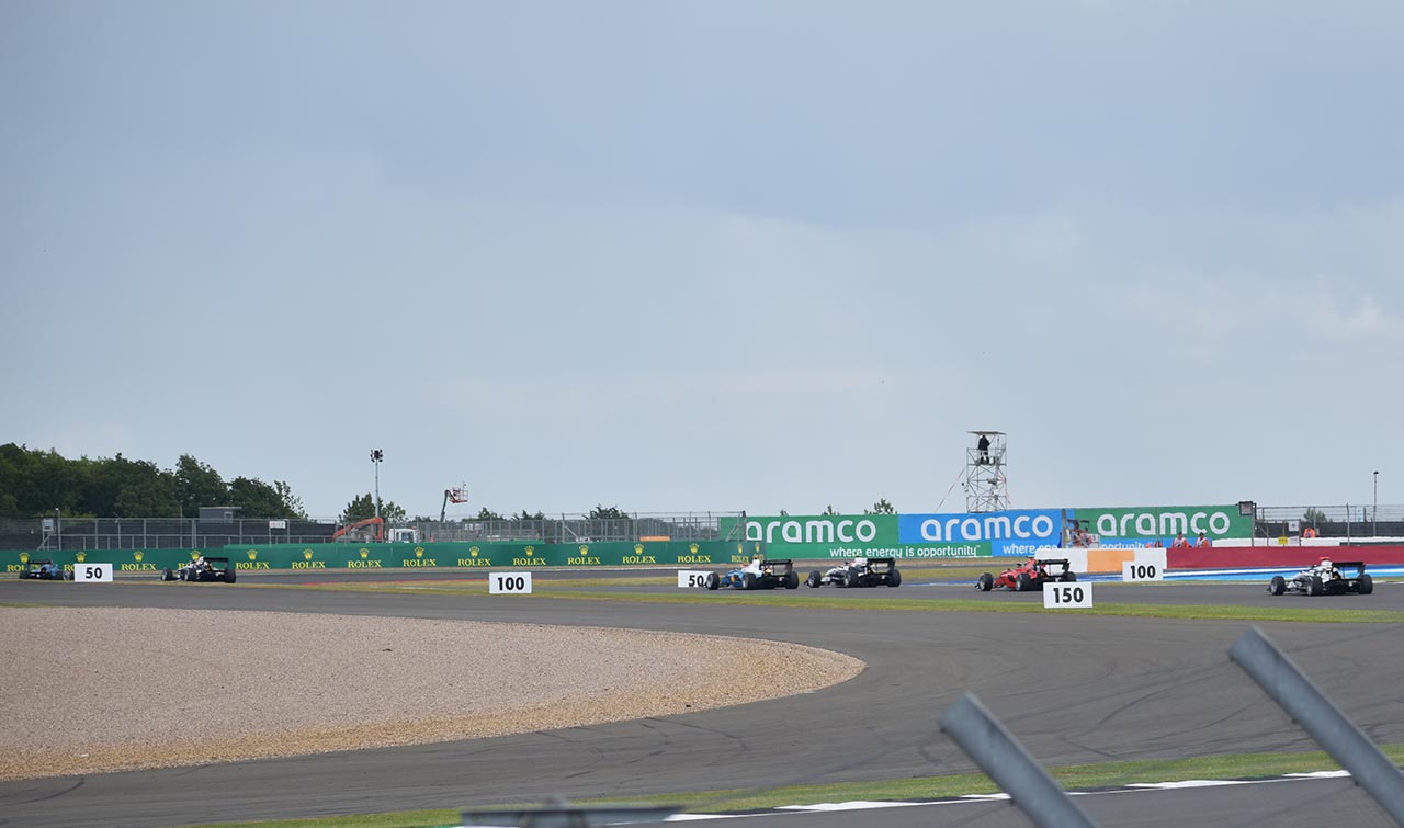 f2 cars racing at the british grand prix