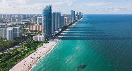 view of miami beach and high rises from the sky