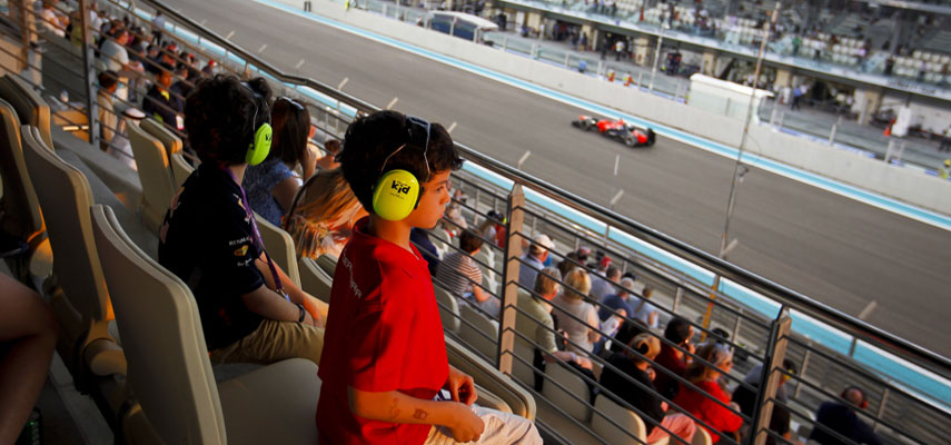small boy watching the action at the abu dhabi grand prix