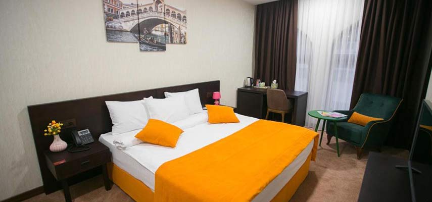 double bedroom with orange covering