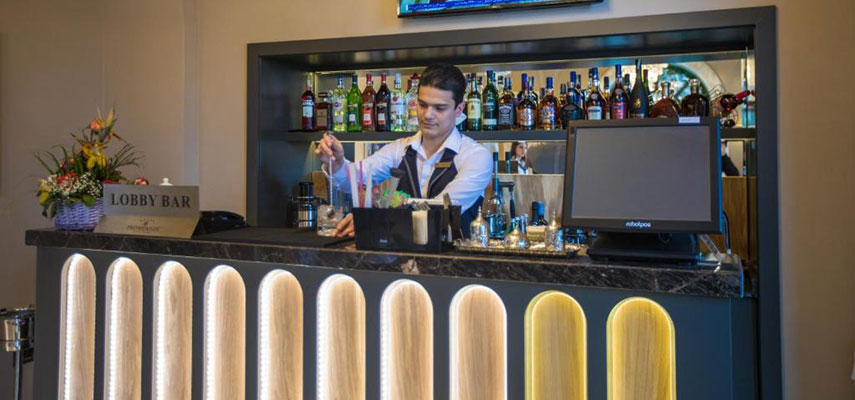 bar man making cocktails in the bar