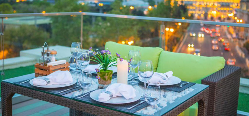 rooftop terrace with settings for dinner