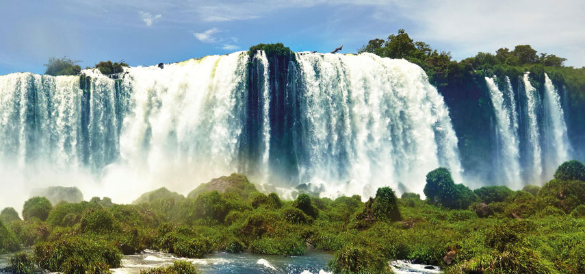 the Iguazú Falls  with water cascading over them