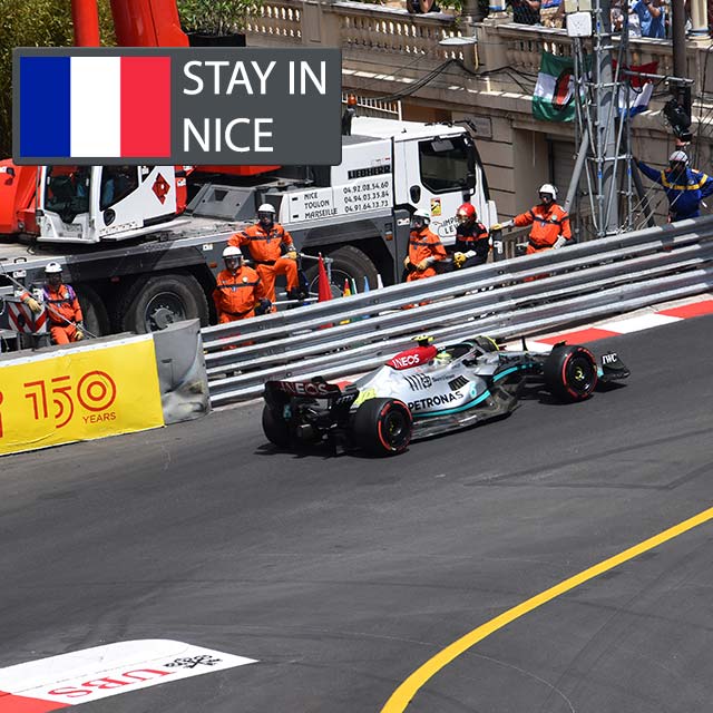 f1 car racing at monaco near the cafe de paris