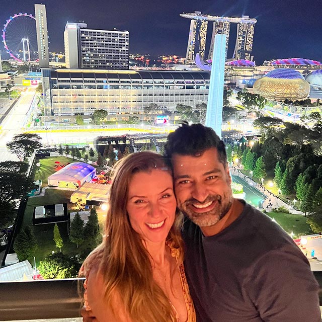 happy couple overlooking the track in singapore