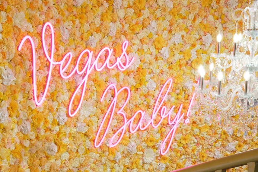 vegas baby message on the wall with flowers