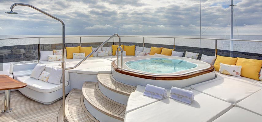 back of the yacht with seating area and jacuzzi