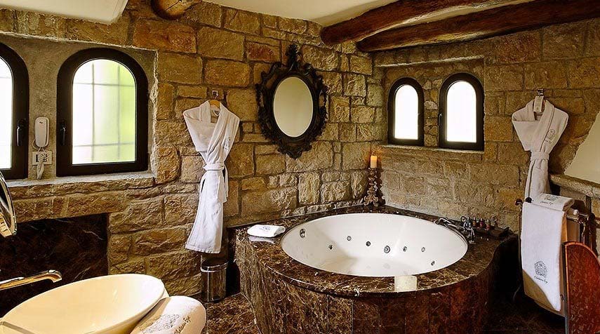 luxury bathroom with jacuzzi and bathropes
