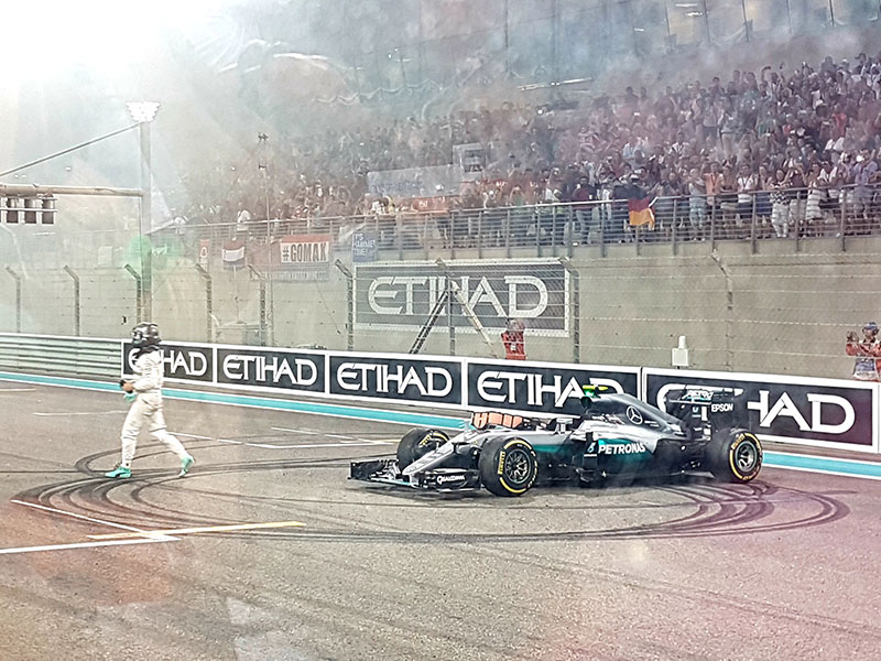 Nico Rosberg is running out of his car after the victory at final race
