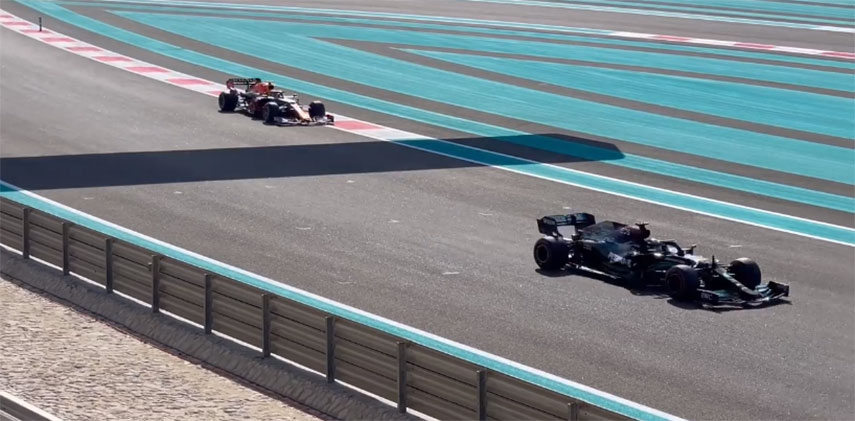 formula one racing cars in action in Abu Dhabi