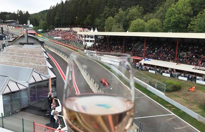 view of the belgium gp 2018 through a wine glass