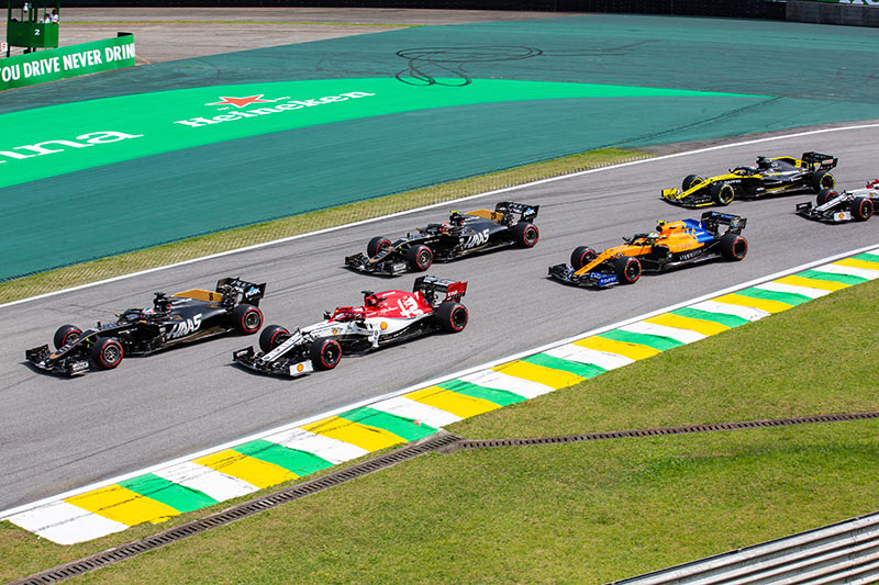 multiple f1 cars racing in brazil