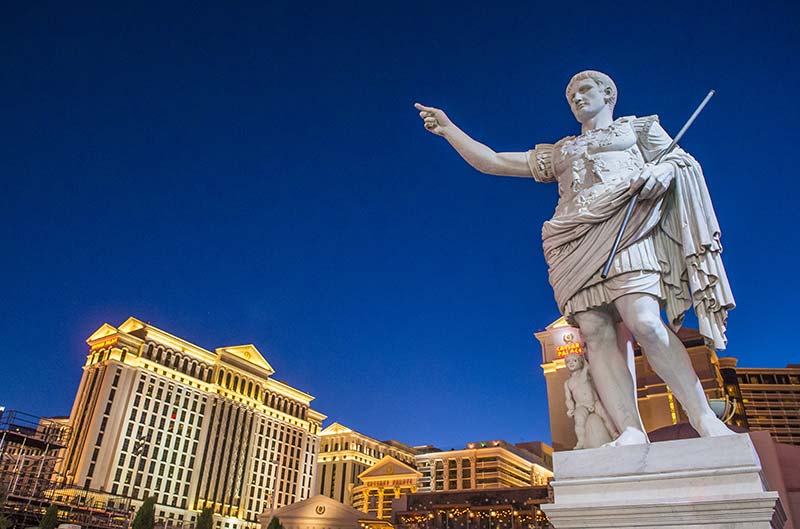 statue of caesar with caesars palace hotel in the background