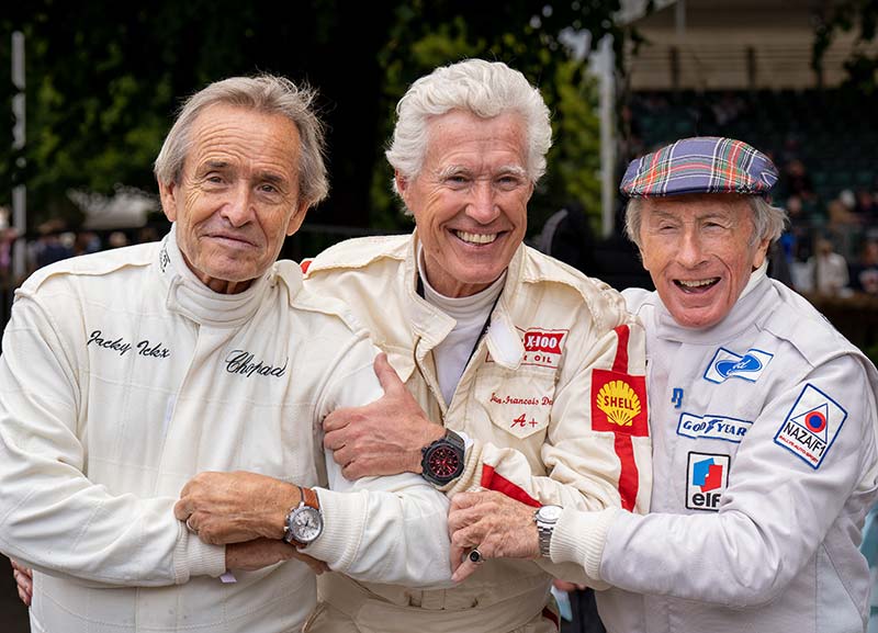 Goodwood, Sussex, UK - 24 Jun 2022: Jackie Stewart, Jacky Ickx, Jean-Francois Decaux, former Grand Prix and Le Mans champions, enjoy racing at the Festival of Speed; celebrating 75 years of  Ferrari
