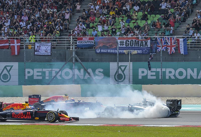 f1 car stopped with clouds of smoke from the tires