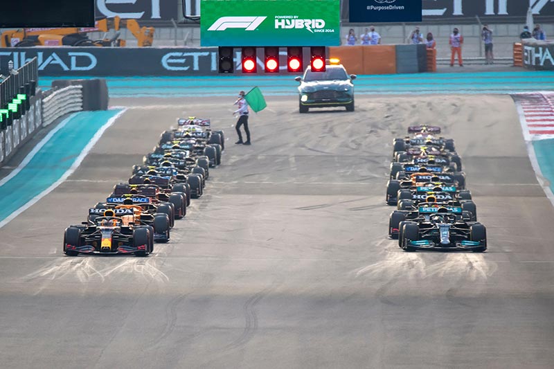 formula one cars ready to race at the start line in abu dhabi grand prix