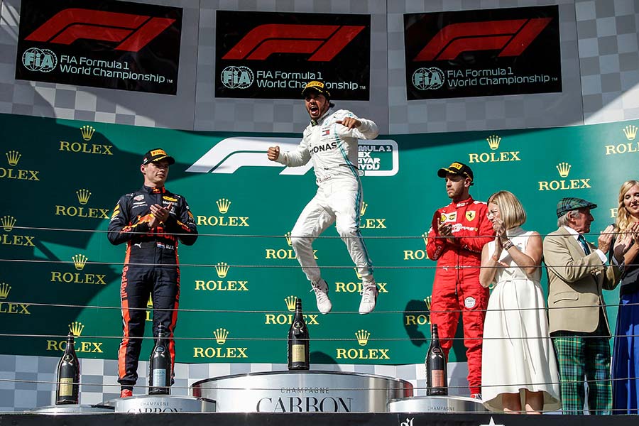Grand Prix of Hungary. F1 World Championship 2019. Lewis Hamilton, Mercedes, on the podium with Verstappen and Vettel, celebrating the victory. 