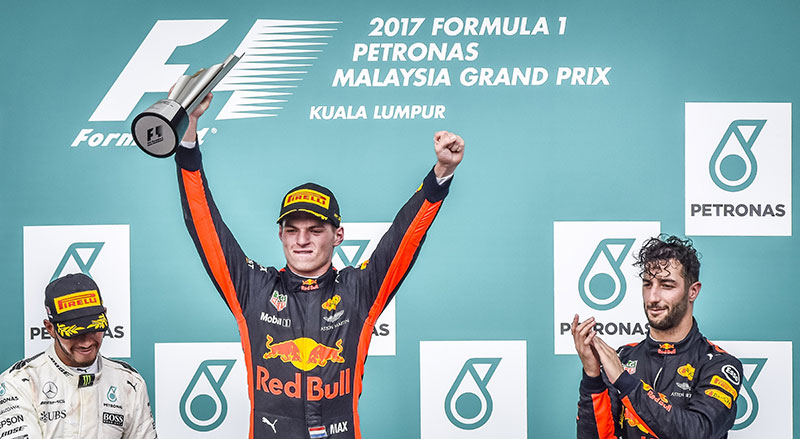 max verstappen on the podium in first place