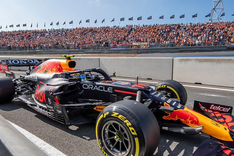 red bull racing car with crowds in the background