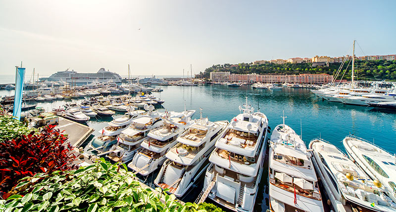 view of the monte carlo harbour with all the luxury yachts