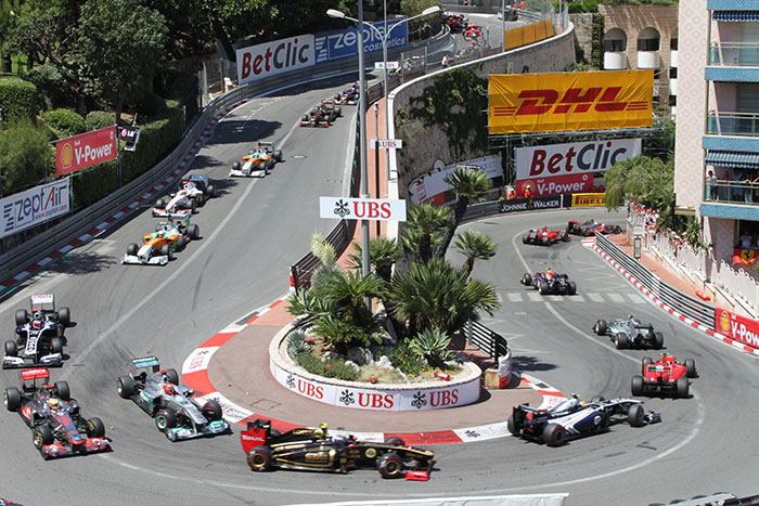 f1 cars racing round the hairpin bend at the fairmont in monaco