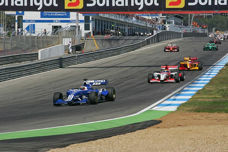 f1 cars reaching a corner at the portugal gp