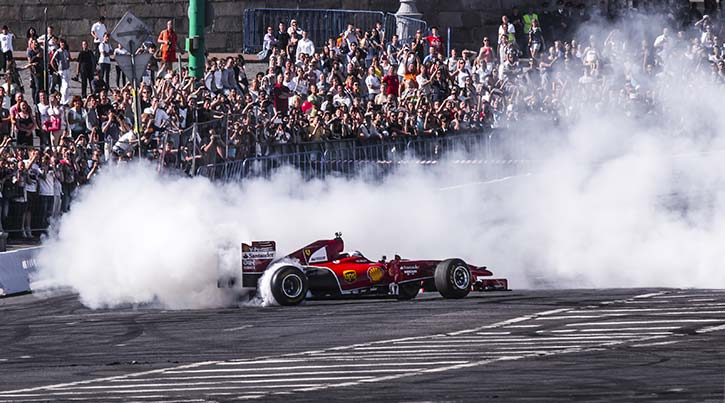 ferrari car in trouble with lots of smoke around it