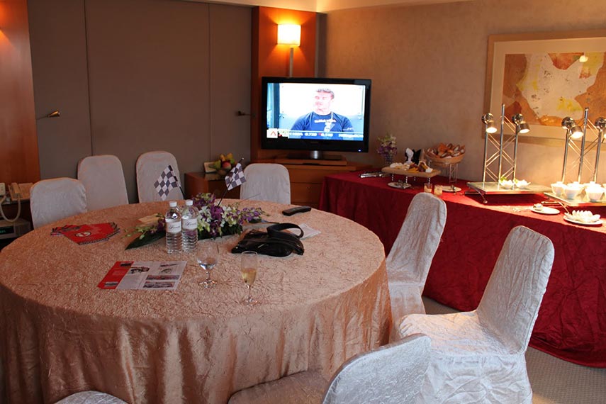 hospitality area set up for guests with TV in the background