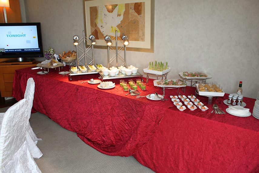 buffet table with food set up for guests