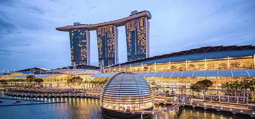views of the marina bay hotel from outside all lit up