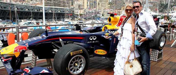 red bull f1 racing car with young coiuple