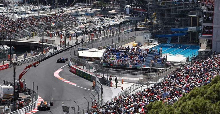 monaco gp with f1 racing cars and views of the pool