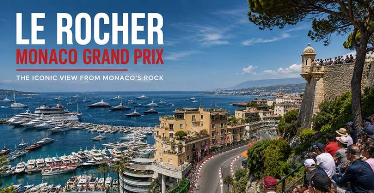 Formula 1 fans watching the Monaco Grand Prix from the Le Rocher viewing area above Port Hercule
