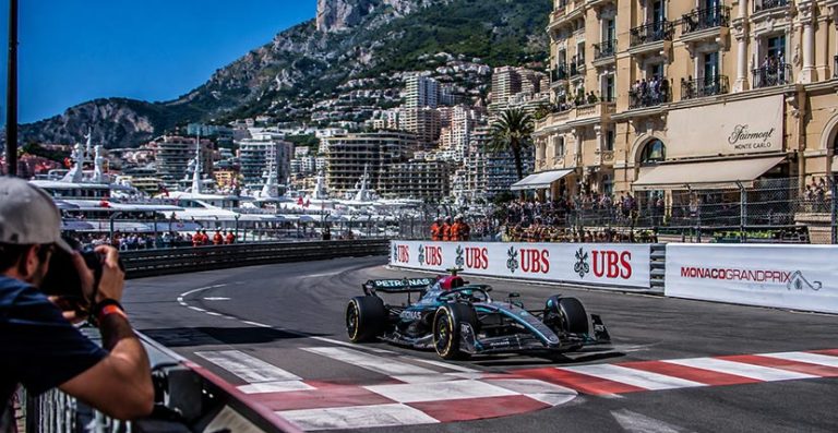 Formula 1 car being photographed on the Monaco Grand Prix circuit near the Fairmont Hairpin